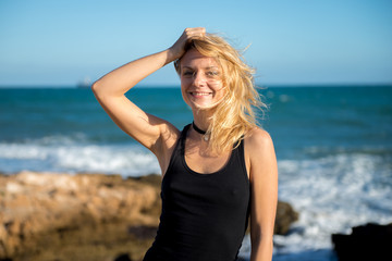 Fototapeta na wymiar Beautiful blonde girl on the beach