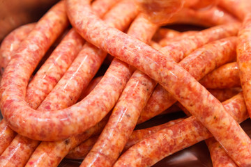 Close view of homemade raw thin sausages