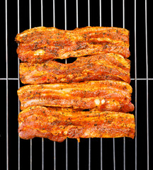 Marinated belly slices on barbecue grid