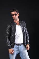 Fototapeta premium handsome man wear black leather jacket with blue jean