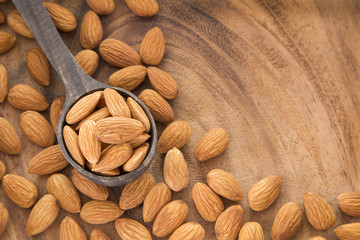 Almonds on the wooden spoon