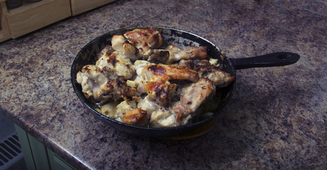 chicken in mustard sauce. chicken pieces in the pan. cooking. The finished dish