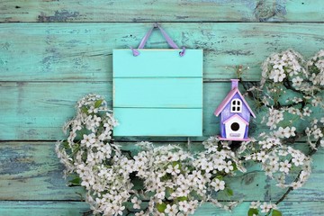 Blank mint green sign with purple birdhouse and floral border