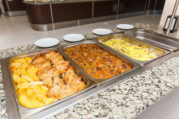 Heated cages with meat dishes