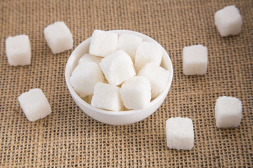 Cubes of sugar in the bowl