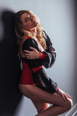 Beautiful sexy young woman dancing isolated in studio