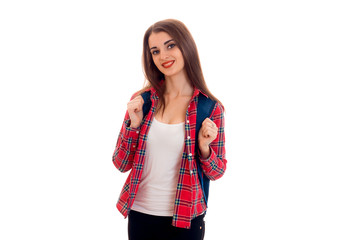 pretty stylish smart student girl with backpack on her shoulders posing and smiling on camera isolated on white background