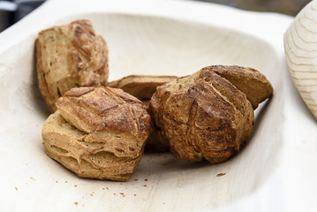 Homemade scones in a wooden bowl