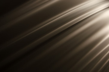 Smooth creases and folds on a colored fabric with highlights and deep shadows