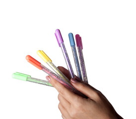 Colored pens set in hand 