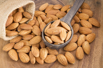 Almonds on the wooden spoon