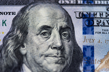 Obraz na płótnie Canvas Closeup portrait of Benjamin Franklin on the hundred dollar bill 