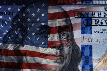 Background of a modern 100 dollar bills, large picture of the stack of hundred dollars and The USA flag