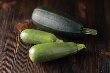 Courgettes on a wooden background.