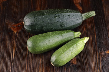 Courgettes on a wooden background.