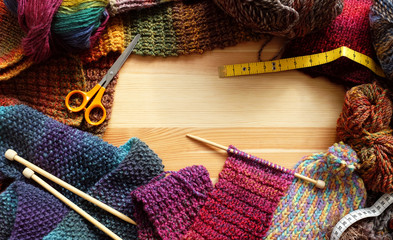 Border of colourful knitting and craft accessories