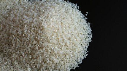 rice pile left on black