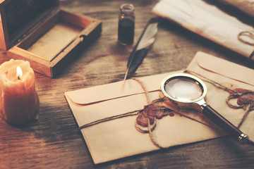 letters and ink on table