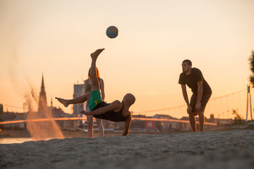 Young people on the beach playing soccer, Drava river, Osijek, Croatia
