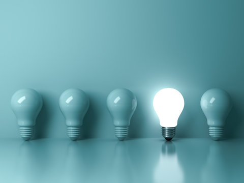 One glowing light bulb standing out from the unlit incandescent bulbs on green background with reflection  individuality and different creative idea concepts 3D rendering