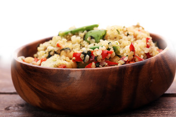 Delicious vegetarian quinoa salad with bell pepper, cucumber and tomatoes