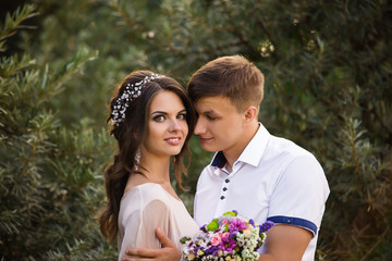 Portrait of young and happy couple in park