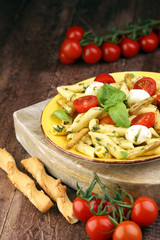 Traditional Italian penne pasta, fresh mozzarella, fresh tomato