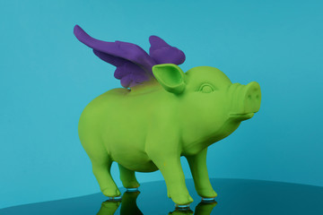 souvenir ceramic green pig with purple wings