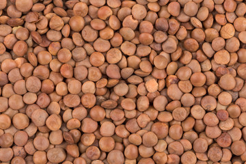 Picture of brown lentils over flat surface