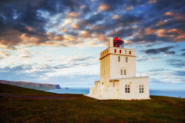 Fototapeta na wymiar Beautiful white lighthouse at Cape Dyrholaey, South Iceland
