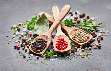 Spices and herbs on a black board