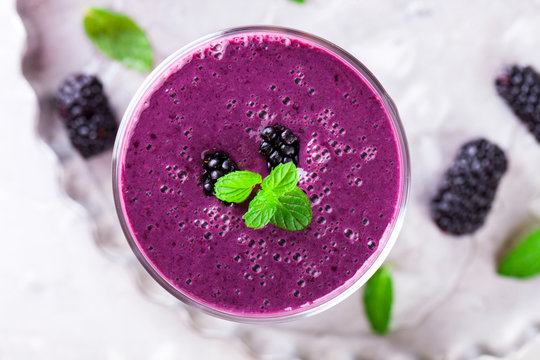 BlackBerry smoothie with Fresh Berries in glasses.Food or Healthy diet concept.Vegetarian. selective focus.