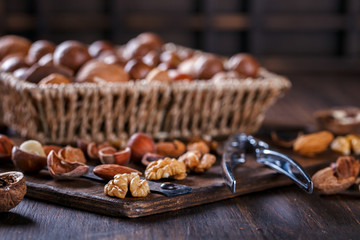 Nuts Mixed on Wooden Background.Assortment, Walnuts,Pecan,Peanuts,Almonds,Hazelnuts,Macadamia,Cashews,Pistachios.Concept of Healthy Eating.Vegetarian.selective focus.
