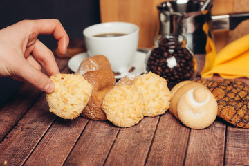 flour products on the table, hand, drink in the cup