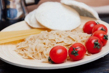 pasta of different kinds of cherry tomatoes on a plate