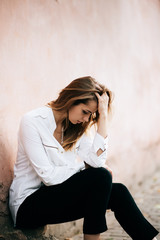 Young student  girl in the street. Teenage study problems concept