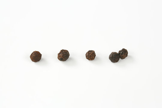 Group Of Black Peppercorns