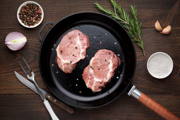 Two pieces of raw meat on a pan ready to roasting.