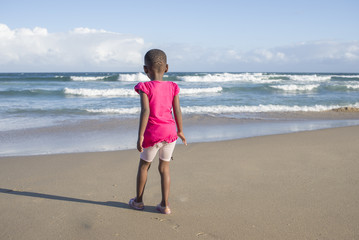 Little Girl in Pink on Beach