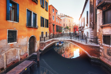 Fototapeta na wymiar Gondolas on canal in Venice, Italy