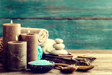Set for spa treatments with cosmetic products for body care and relaxation on wooden background...