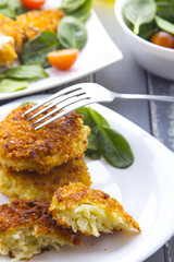 Food fried breading chicken spinach salad tomatoes pancakes from potatoes

