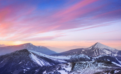Fototapeta na wymiar Mysterious winter landscape majestic mountains in 