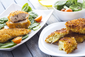 Food fried breading chicken spinach salad tomatoes pancakes from potatoes
