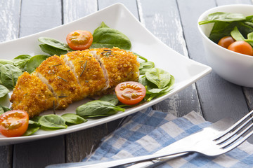 Food fried breading chicken spinach salad tomatoes pancakes from potatoes
