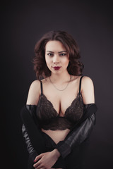 Fabulous woman in lace lingerie and  jacket on her shoulders