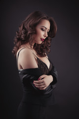 Young woman in lace lingerie and leather jacket