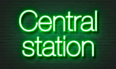 Central station neon sign on brick wall background.