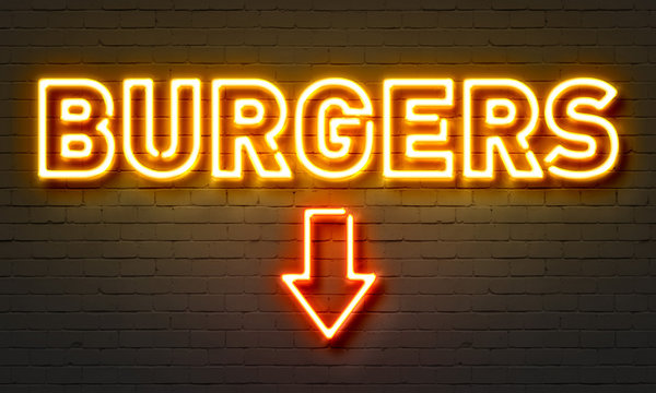 Burgers neon sign on brick wall background.