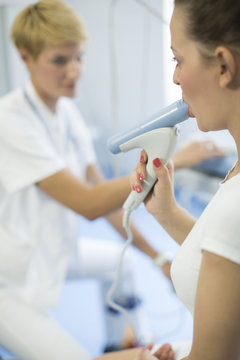 Female patient undergoing lung funtion test, Munich, Bavaria, Germany